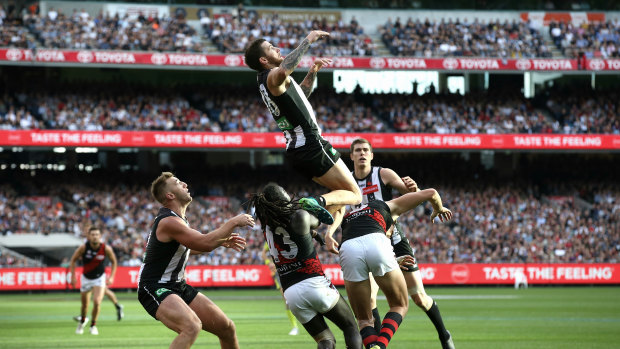 Collingwood's Jeremy Howe flies over Joe Daniher in last year's Anzac Day game.