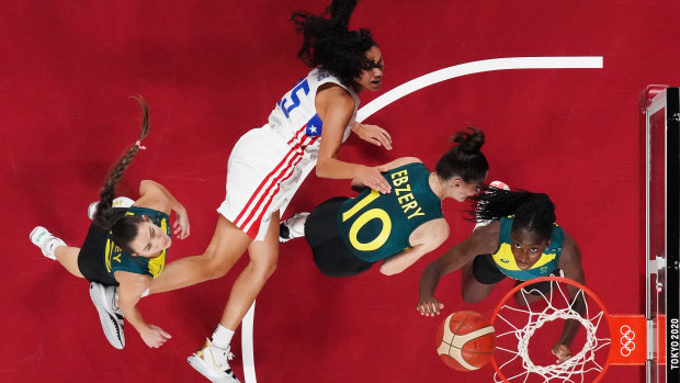 Ezi Magbegor #13, Katie Ebzery #10 and Tess Lavey #12 of Team Australia fight for possession of a rebound with Isalys Quinones #25 of Team Puerto Rico.