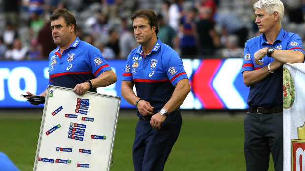 Back to the whiteboard: Luke Beveridge and the Bulldogs coaching staff during the round two loss to West Coast.