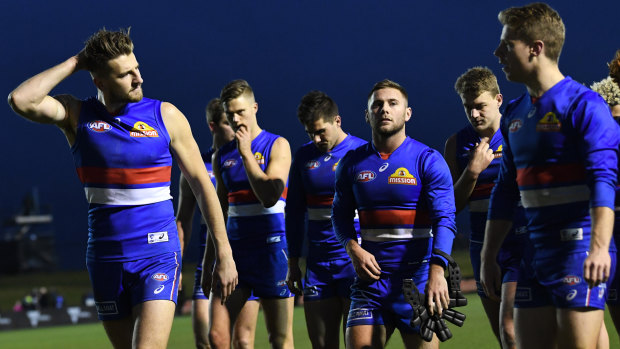 Twilight saga: Marcus Bontempelli (left) leads the Bulldogs from the ground after their round 19 loss to Port Adelaide.