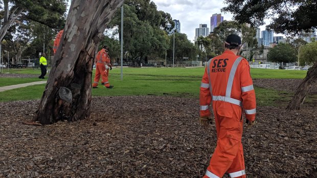 SES volunteers look for evidence in South Melbourne.