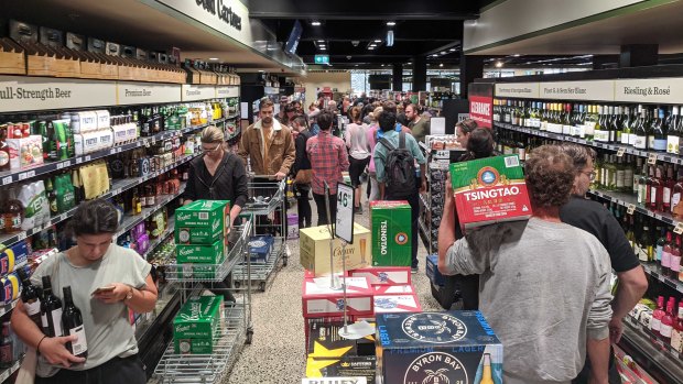 The line at Dan Murphy's in Brunswick on Sunday snakes up one side of the aisle and down the other.