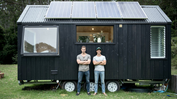 Brothers Chris and Cam Grant with one of their tiny houses. 