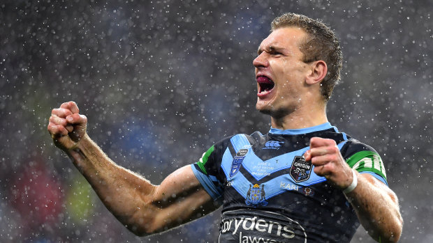 Wet and wild: Tom Trbojevic on his way to a hat-trick for NSW in Perth.