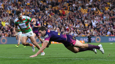 Triple treat: Broncos winger Corey Oates crosses for his third try.