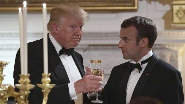 Donald Trump, left, and Emmanuel Macron, share a toast during the State Dinner at the White House.