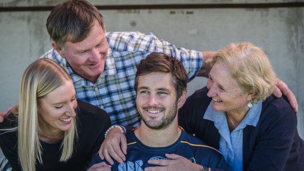 Brumbies captain Sam carter with fiancee Maddi, dad David and mum Susan at training on Friday.