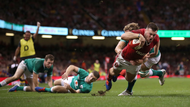Minor comeback: Owen Lane dives over to score Wales' first try against Ireland.