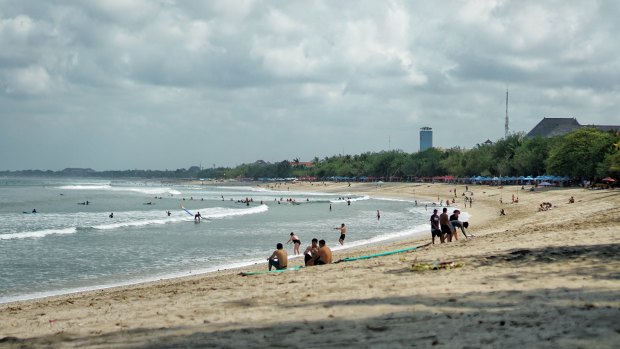 The two-kilometre stretch of sand at Kuta Beach is popular with holidaymakers.