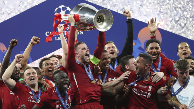 Six times: Liverpool captain Jordan Henderson and teammates with the Champions League trophy.