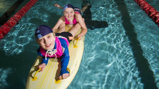 Canberra Nippers Michael Woods, 7, with sister Anastasia, 10, at Civic Pool.