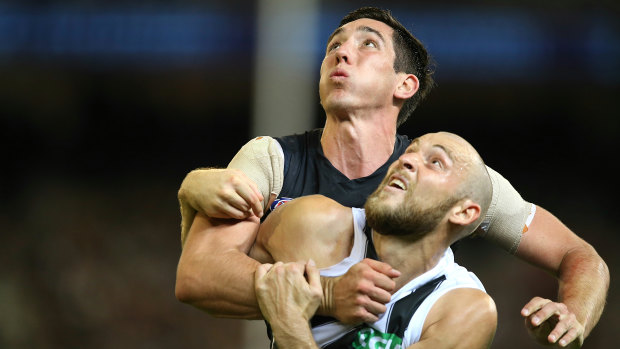 Jacob Weitering defends against Collingwood's Ben Reid in 2018 – a year in which he struggled.