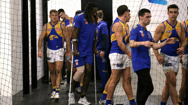 Nic Naitanui on crutches in the West Coast rooms after the match.