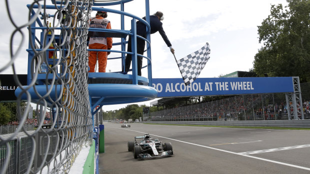 Lewis Hamilton takes the chequered flag for Mercedes to win the Italian Grand Prix at Monza on Sunday.