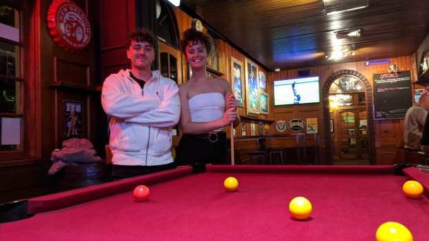 Charles Parker, 25, and Peta Varga, 26, enjoy their last night for a fair while at Carlton's Great Northern Pub.