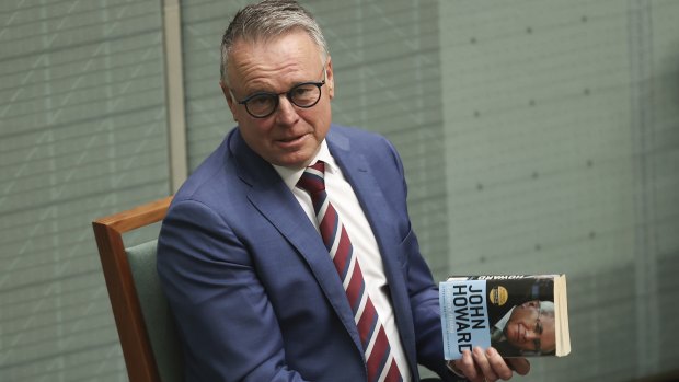 Labor MP Joel Fitzgibbon holds a copy of John Howard’s book ‘Lazarus Rising’ in Question Time.