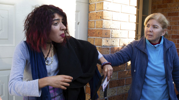 Mert Ney's family outside their Marayong home.