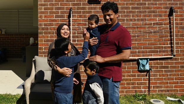 Mohammed Islam with his wife Afsana Fardous and their sons four-year-old Diyan Islam, eight-year-old Shayan Islam and six month-old Sinan Islam in the backyard of their home in Hurstville.