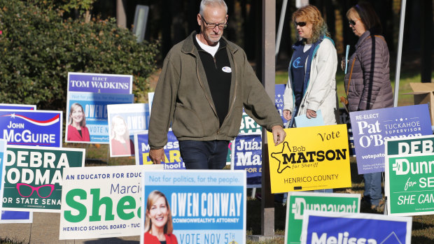Voters walk through a sea of campaign signs at a polling station in Richmond, Virginia.