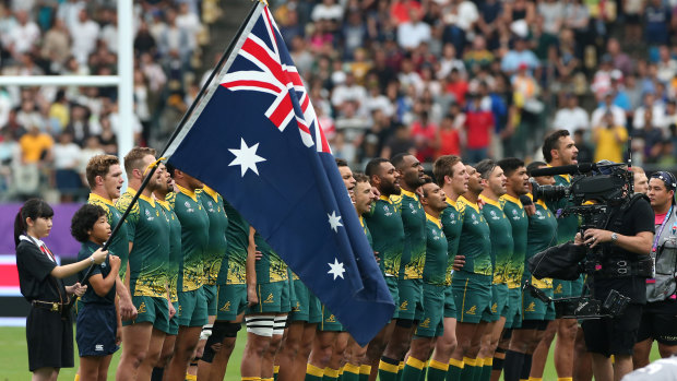 Australian players line up for the national anthem prior to the Rugby World Cup between Australia and Uruguay at Oita Stadium in 2019