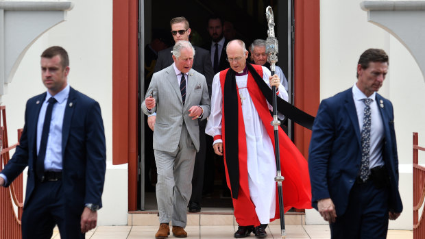 Prince Charles leaves after Sunday church service at St John's Anglican Church in Cairns with Bishop Bill Ray on Sunday.