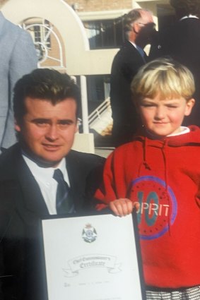 Stephen Wilson receiving a police commendation for the Mildura undercover operation with his son Tristan.