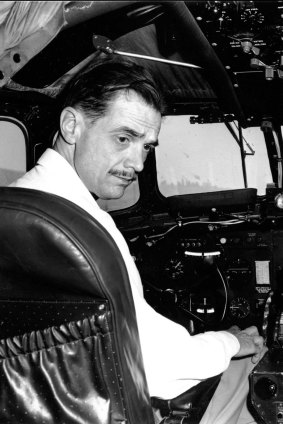 Howard Hughes is shown at the controls of his eight-engine wooden flying boat "The Spruce Goose", 1947.
