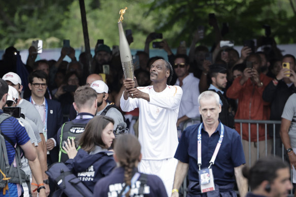 Snoop Dogg with the Olympic torch.