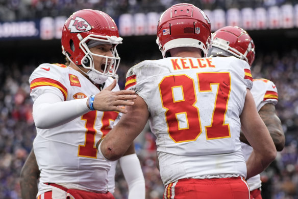 Patrick Mahomes and Travis Kelce celebrate a touchdown during the AFC championship game.