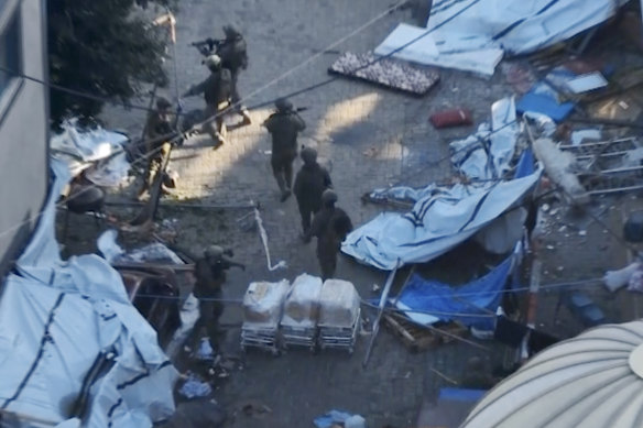 Israeli soldiers in the grounds of Al Shifa hospital in Gaza City. 