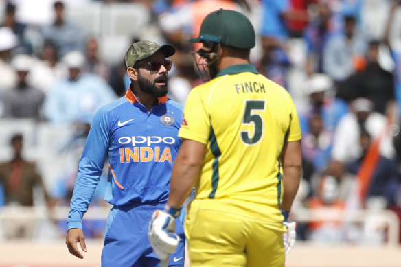 High stakes: India’s Virat Kohli and Australia’s Aaron Finch share a moment.