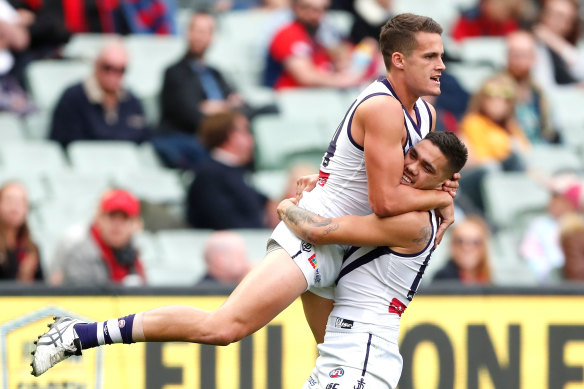 Harley Balic is hugged by fellow Docker Michael Walters after kicking his first AFL goal, in 2017.