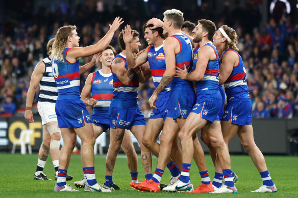 James O’Donnell is mobbed after kicking his first AFL goal.