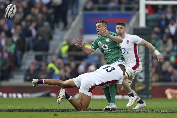 Ireland playmaker Johnny Sexton is wrapped up around the waist during last year’s Six Nations.