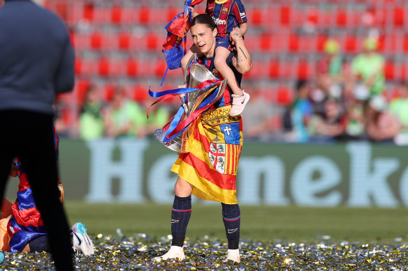Mapi Leon celebrates after winning the UEFA Women’s Champions League Trophy in 2023.