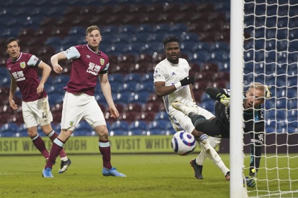 Leicester keeper Kasper Schmeichel saves a shot from Burnley’s Chris Wood at Turf Moor.