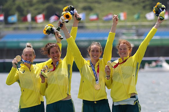 Lucy Stephan, Rosemary Popa, Jessica Morrison and Annabelle McIntyre enjoy the spoils after victory in the women’s four.