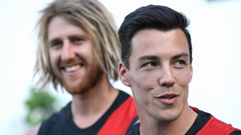 Dyson Heppell with Dylan Shiel.