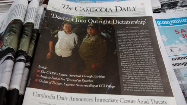 The final issue of The Cambodia Daily is sold at a newsstand, in Phnom Penh last September.