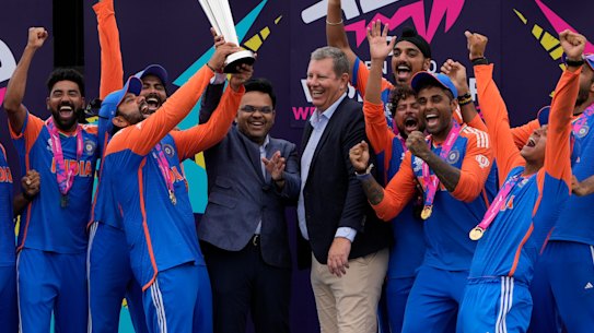 BCCI boss Jay Shah hands the ICC T20 World Cup trophy to India’s captain Rohit Sharma alongside ICC chair Greg Barclay.