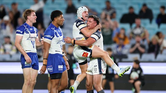 Reed Mahoney celebrates a Cowboys try with Scott Drinkwater.