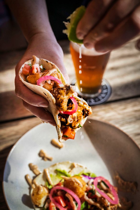 The pub menu includes burgers, pasta, schnitzels and tacos. 