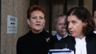 Pauline Hanson leaves court with her barrister, Sue Chrysanthou, SC, in Sydney on Monday.