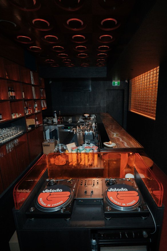The bar features top-quality audio equipment, from decks to speakers.