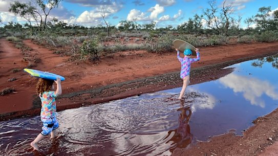 Gwenaelle and Camille Barton playing at Ethabuka Reserve after the monsoonal rains.