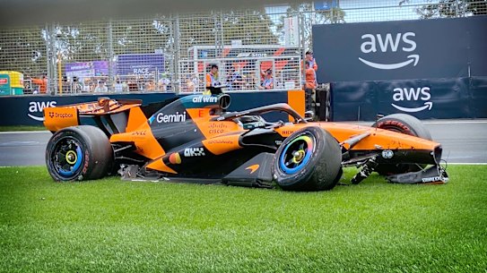Oscar Piastri’s car sits abandoned after he crashed out on a warm-up lap.