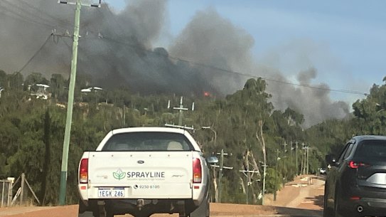 An out of control bushfire is threatening lives and homes in the Perth hills.