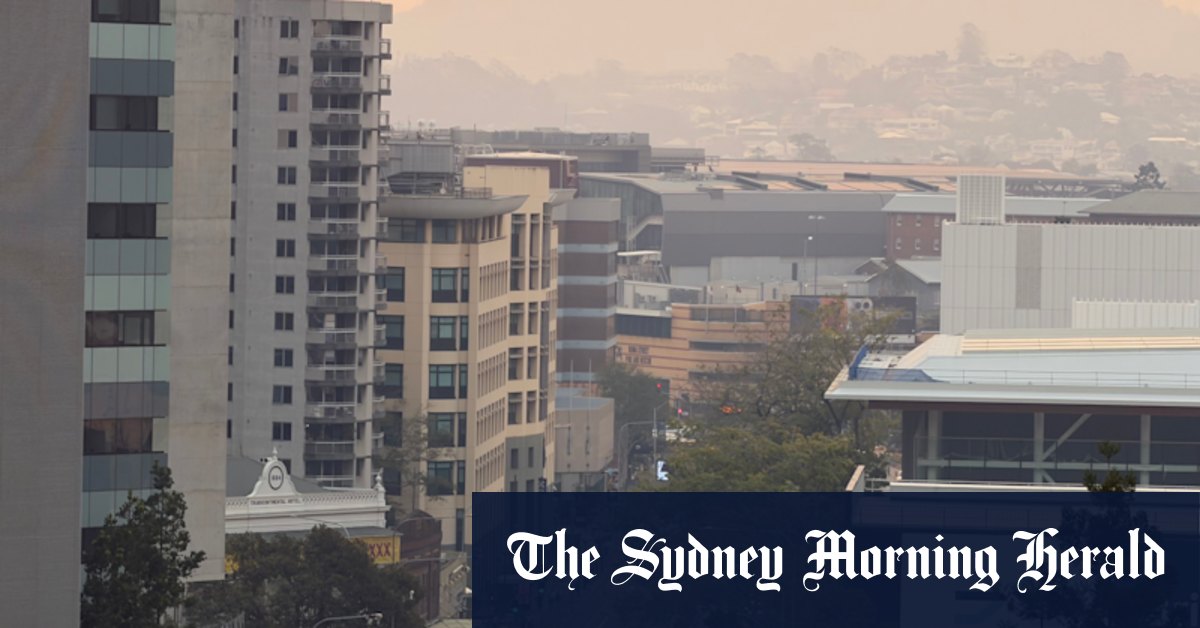 Smoke blankets scorching city as thousands still without power after storm