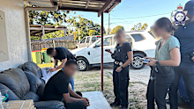 A Redbank Plains man, 51, has been arrested after allegedly trying to bribe public officials in Bangladesh.