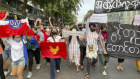 Pro-democracy protesters hold a flash mob rally to protest against Myanmar’s military-installed government, at Kyauktada township in Yangon, on December 20.